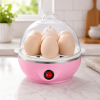 Cozedor elétrico de ovos rosa em cozinha clara